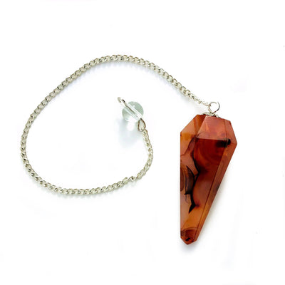 a single carnelian pendulum with a silver chain on a white background