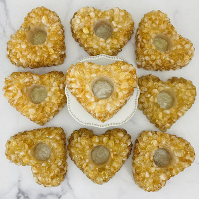 9  Citrine Tumbled stone Heart Candle Holders on a table showing stock available