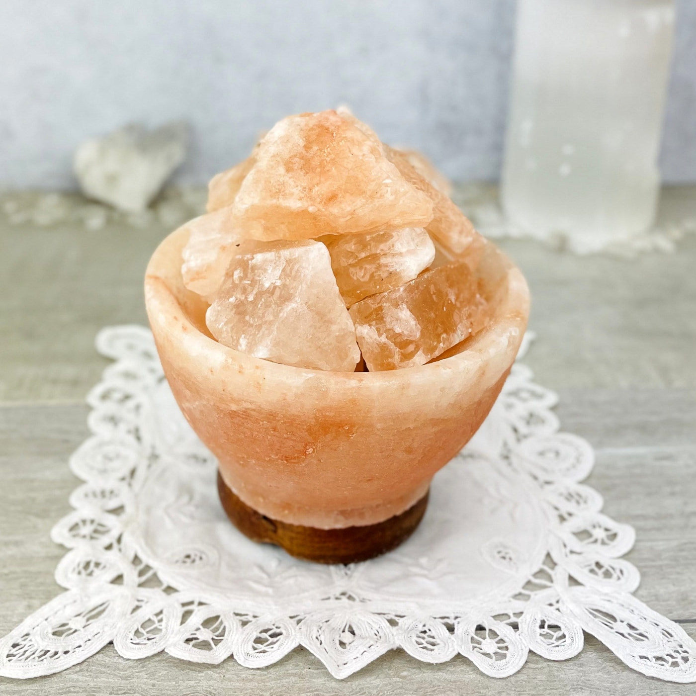 up close shot of Himalayan Salt Lamp with decorations in the background