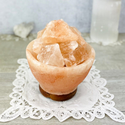 up close shot of Himalayan Salt Lamp with decorations in the background