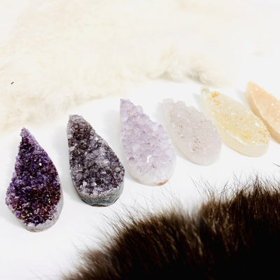 angled shot of 6 druzy cabochons with decorations 