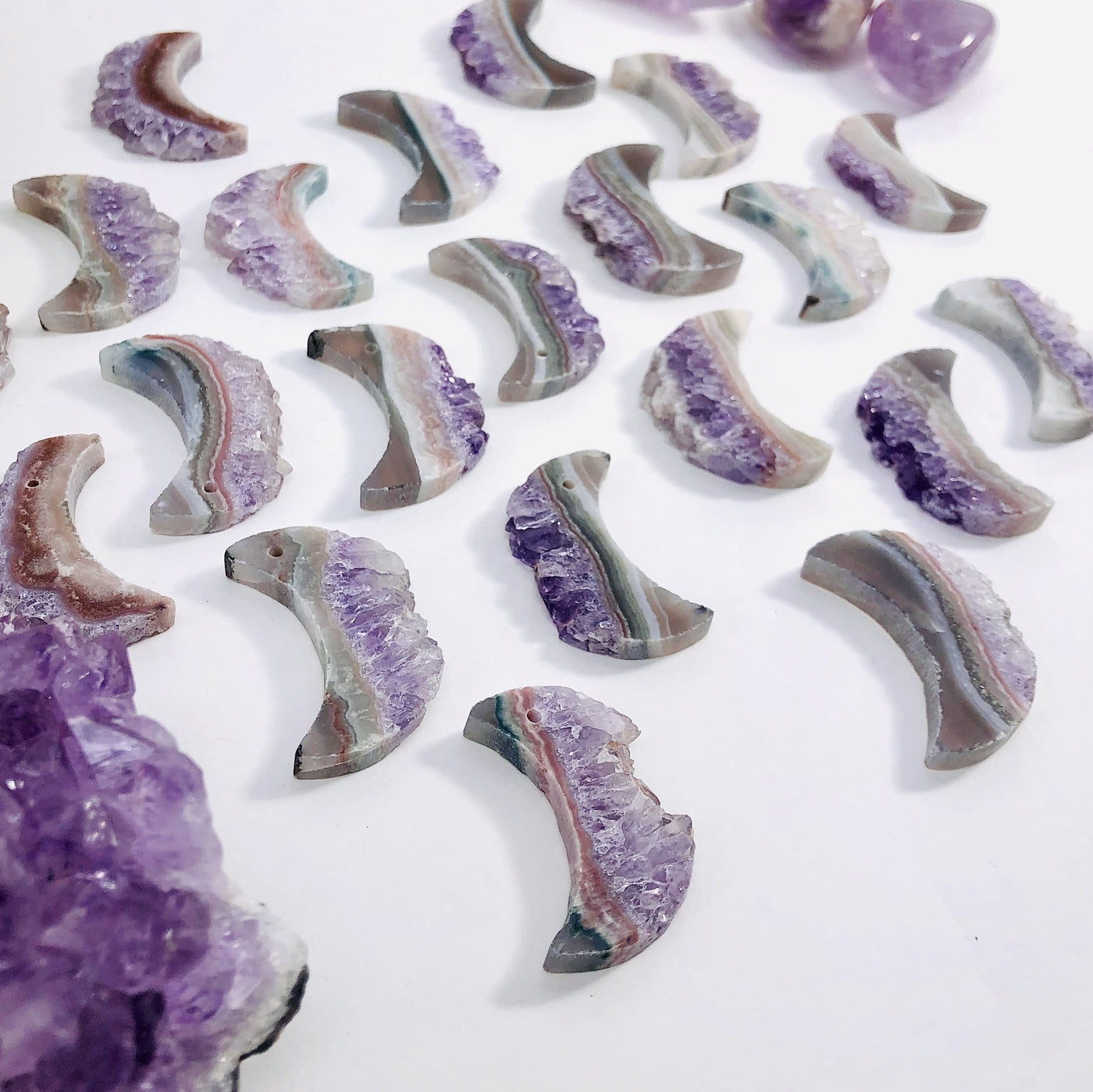Amethyst Moon Crescent shown at a slight angle so you can see thickness