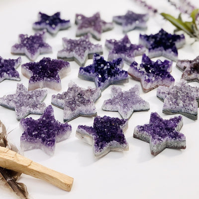 Amethyst Druzy Stars laying on a table