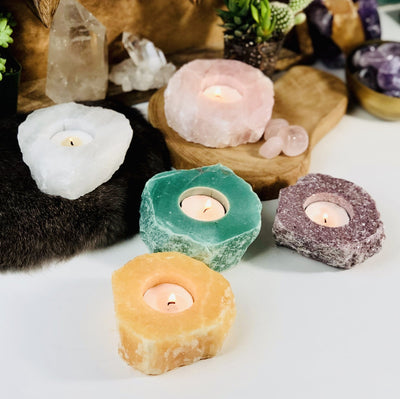 Rough Stone Candle Holder in different crystals with decorations in the background