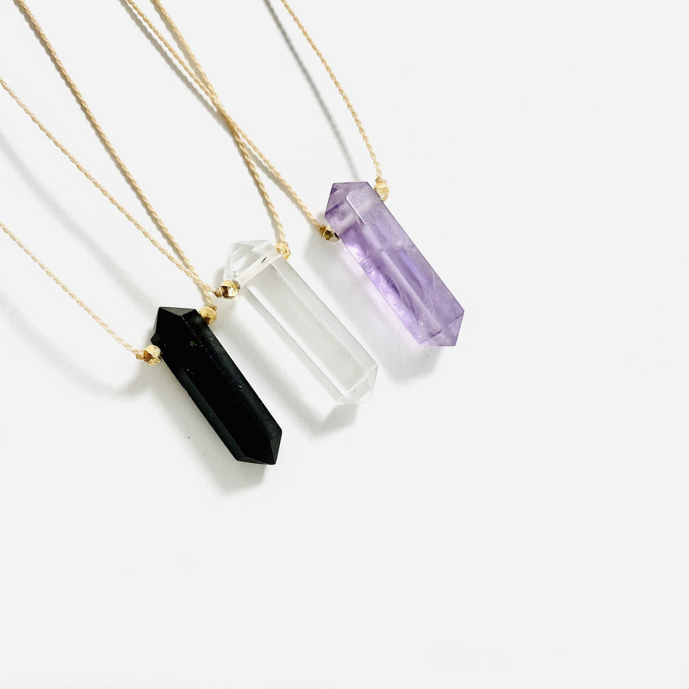 necklaces available in black tourmaline, crystal quartz and amethyst 