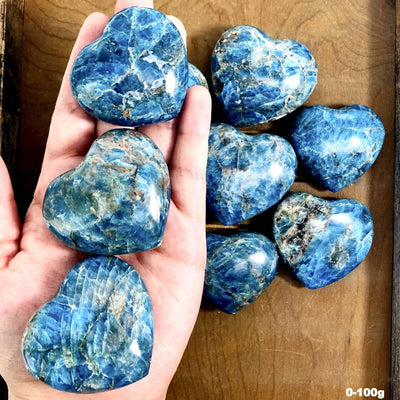 Blue Apatite Polished Hearts in hand by weight 0-100g