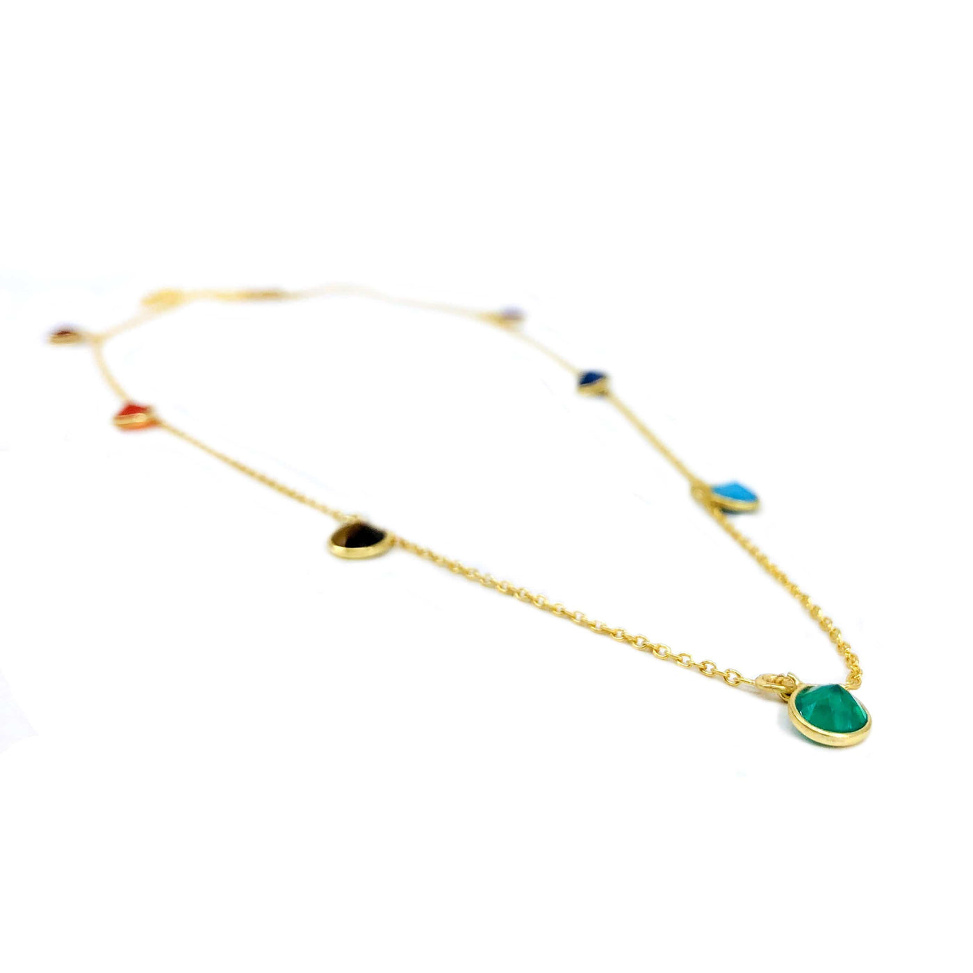 angled view of gold seven chakra dangle necklace