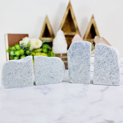 2 blue calcite book end pairs with decorations blurred in the background