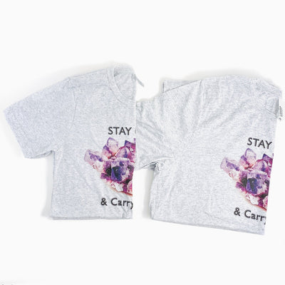 different sized Stay Calm and Carry One t shirts in gray