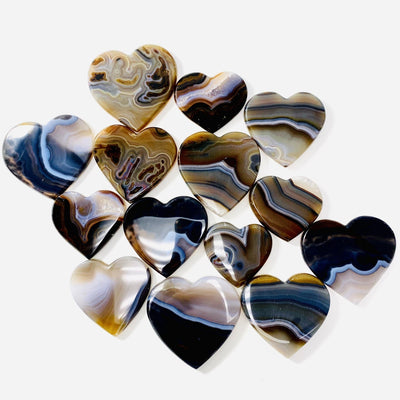 Natural Agate Heart Slices spread out on a white background.