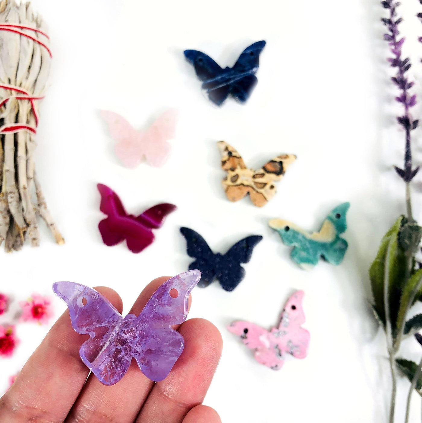 gemstone butterfly displayed in hand for size reference