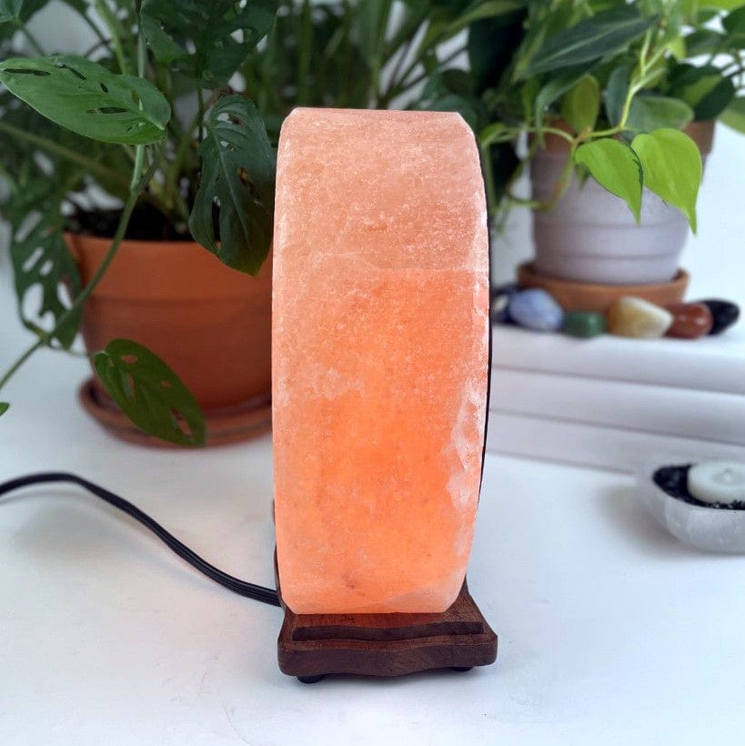 Himalayan salt lamp with sun moon design upside down side view