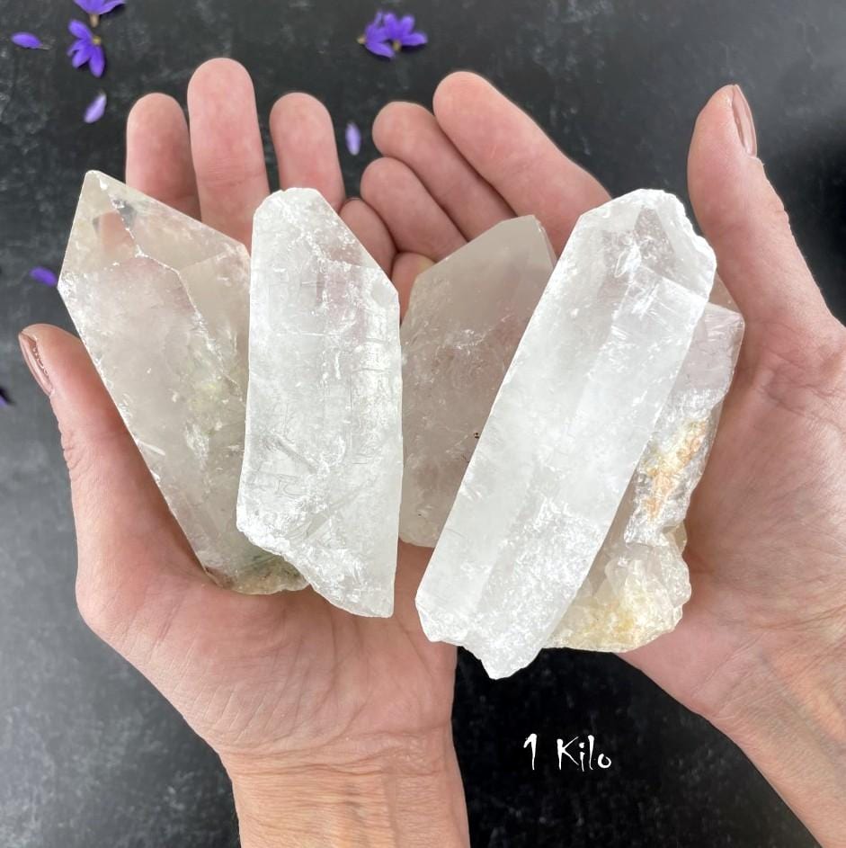 1 Kilogram Bag Crystal Point Grade A in hands to show sample of stock