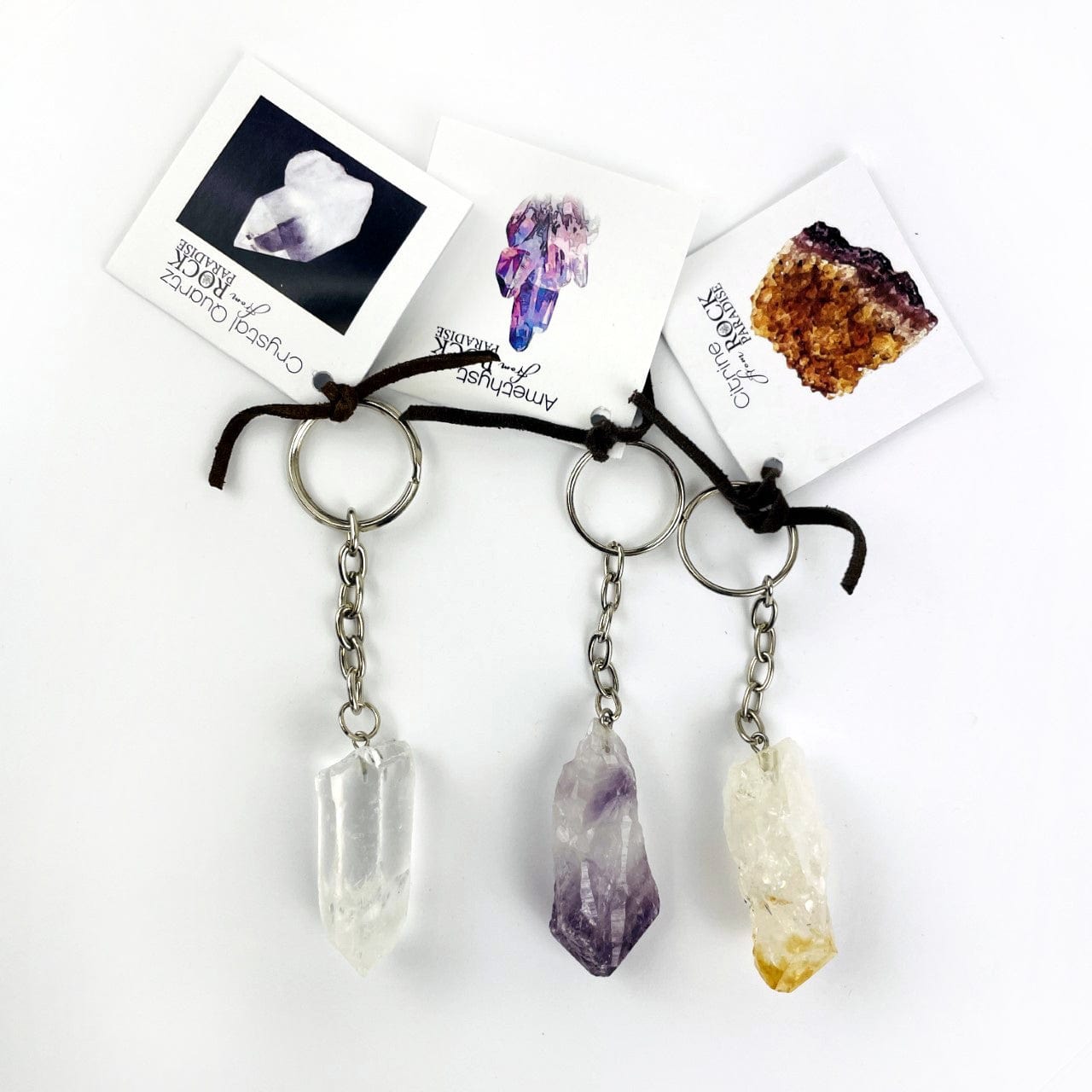 One of each of the Crystal Quartz Point, Amethyst point and Citrine Point keychains