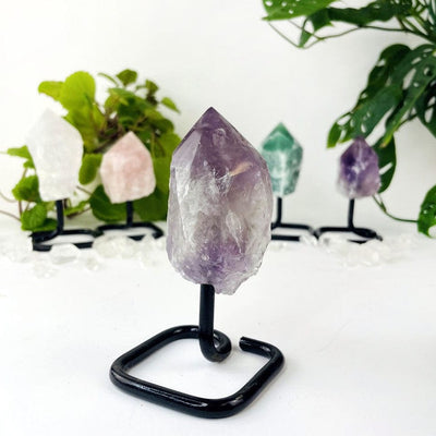 Semi Polished Points on Metal Stand with Amethyst up close