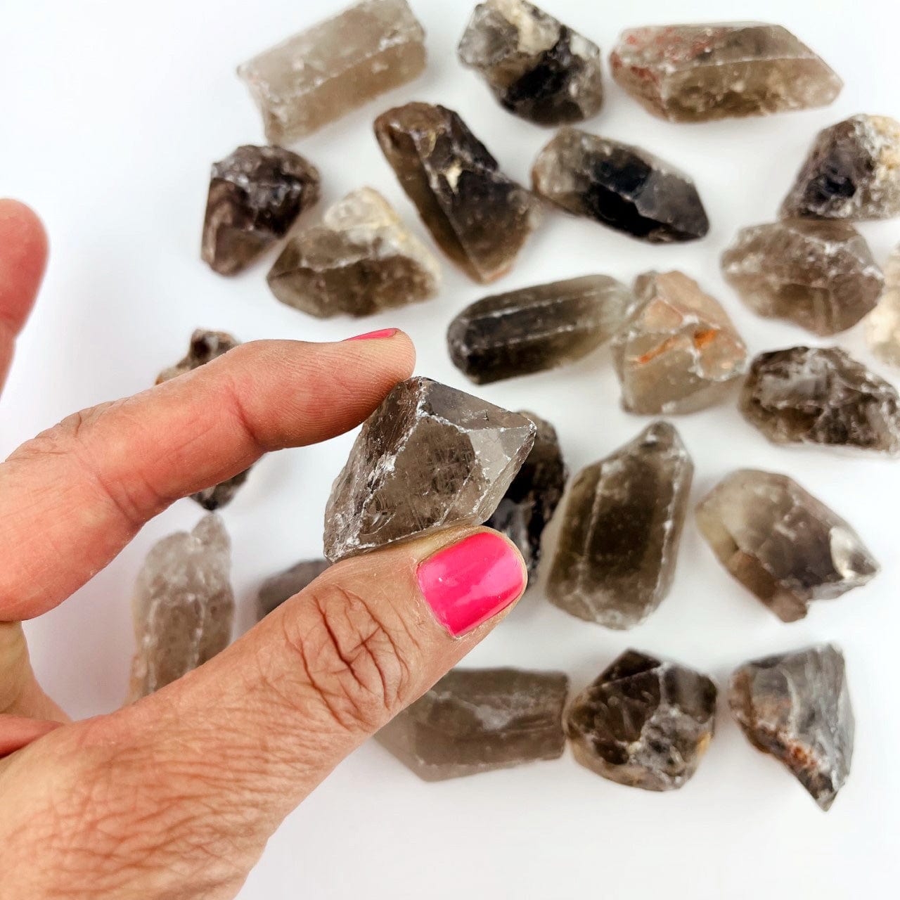 Smoky Quartz Natural Stone in a hand for size