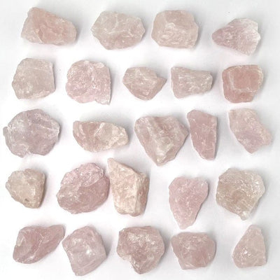 Rose Quartz Natural Stones layed out on a table