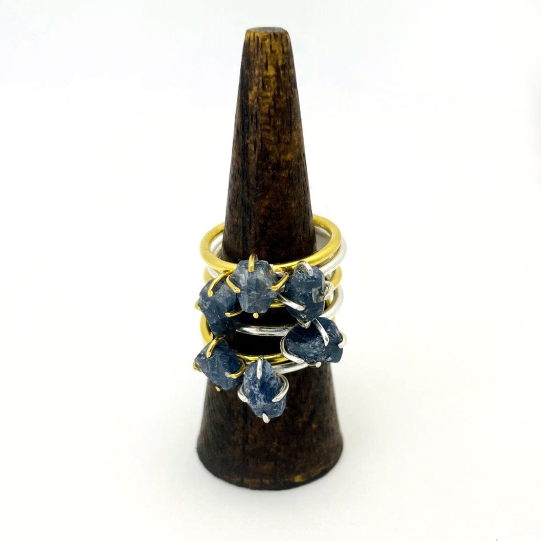 Sapphire Gemstone Rings in Gold and Silver stacked on display