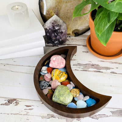 Brown Crescent Moon Wood Tray displayed with crystal inside to show an idea on how to use it