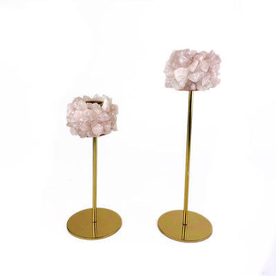 2 Rose Quartz Taper Candle Holders of different sizes on white background