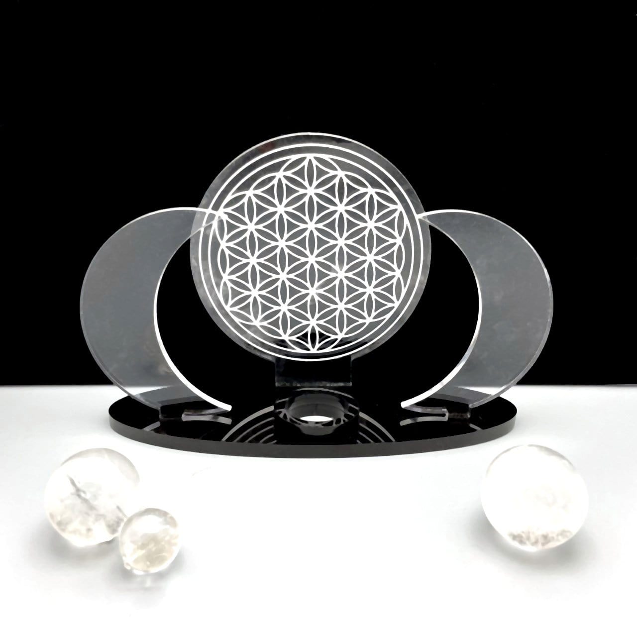 An Acrylic Sphere Holder Crescent Moons with Flower of Life with no sphere. Surrounding spheres are for display.