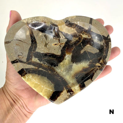 septarian heart bowl in a hand
