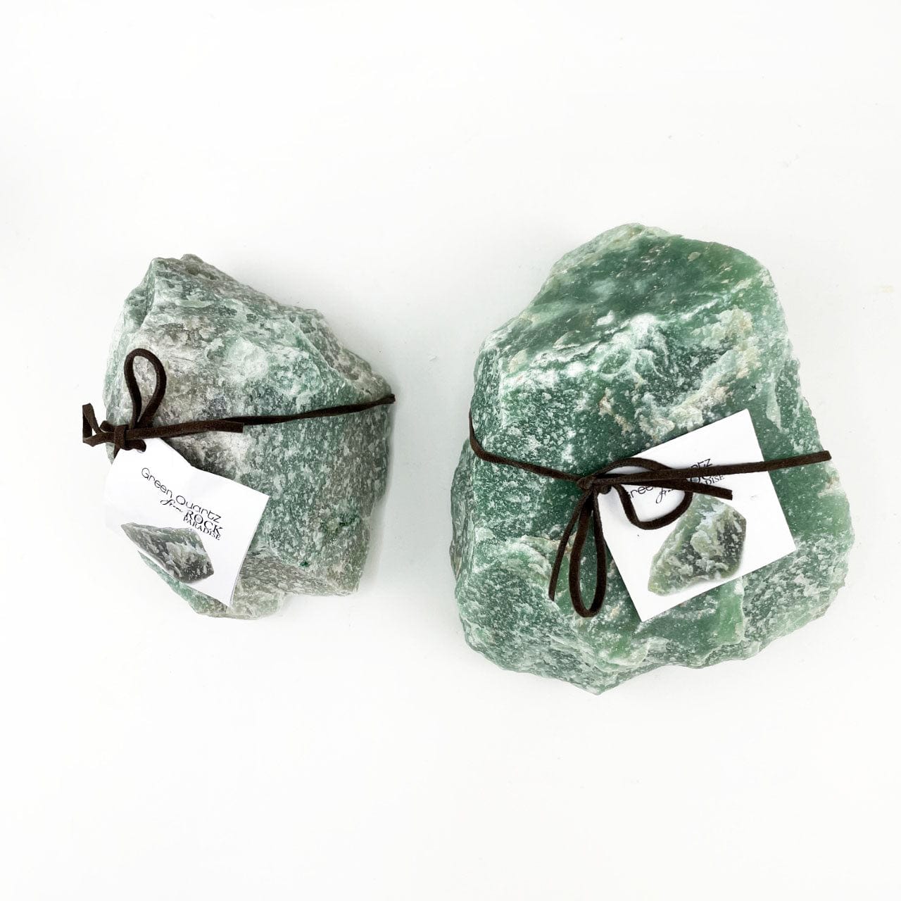 the 2 sizes of green quartz stone tied and tagged with stone info card