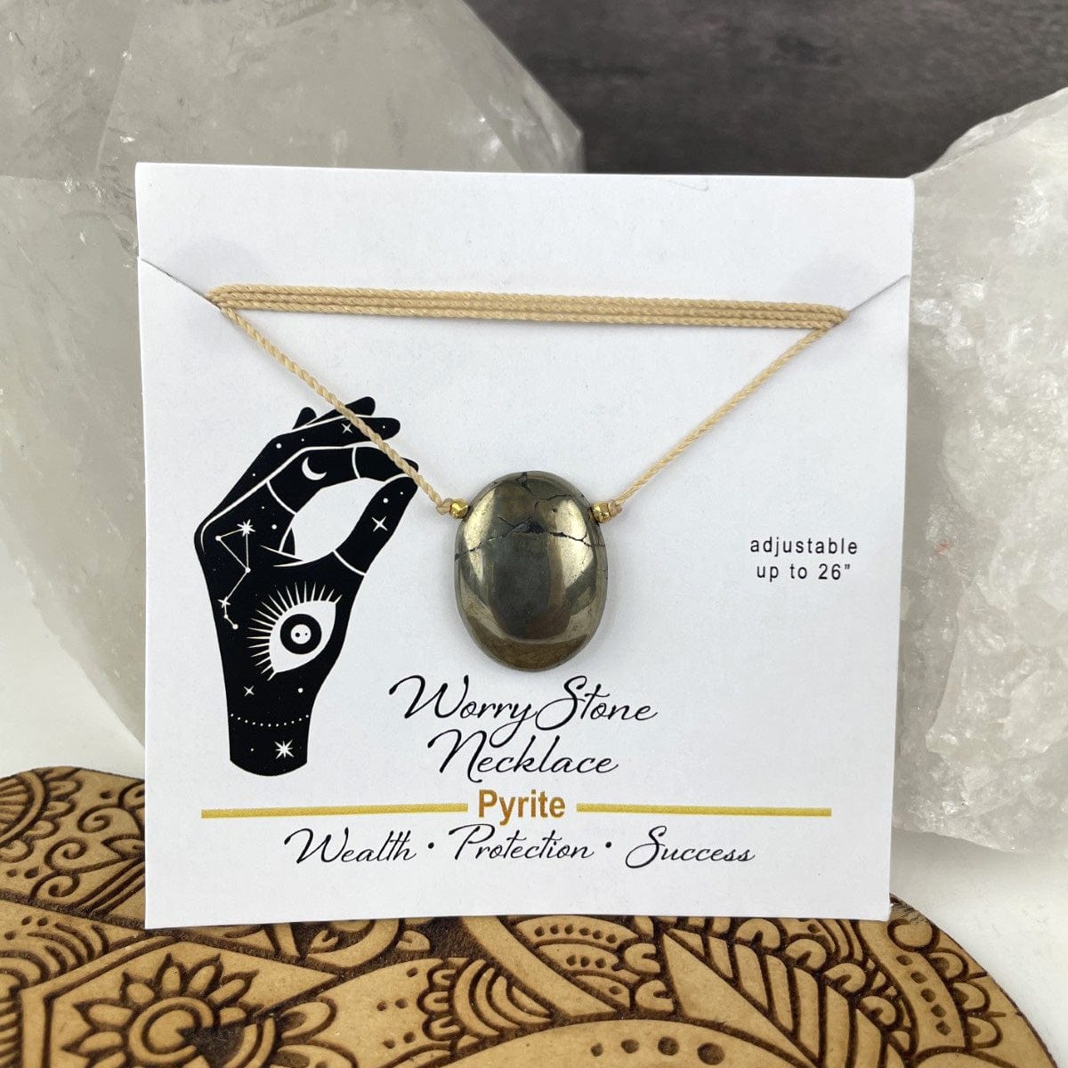 Pyrite worry stone necklace on a card