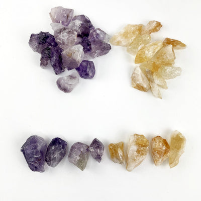 Amethyst and Citrine (Golden Amethyst)  Pieces on a table to show varying sizes