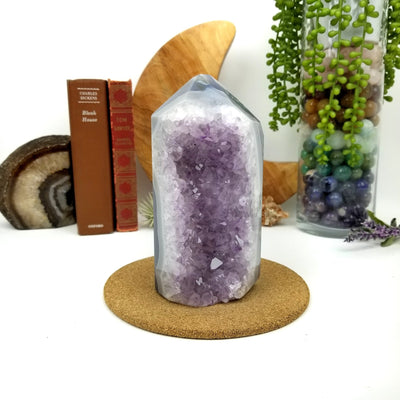 Amethyst Geode Druzy Polished Cut Base with decorations in the background