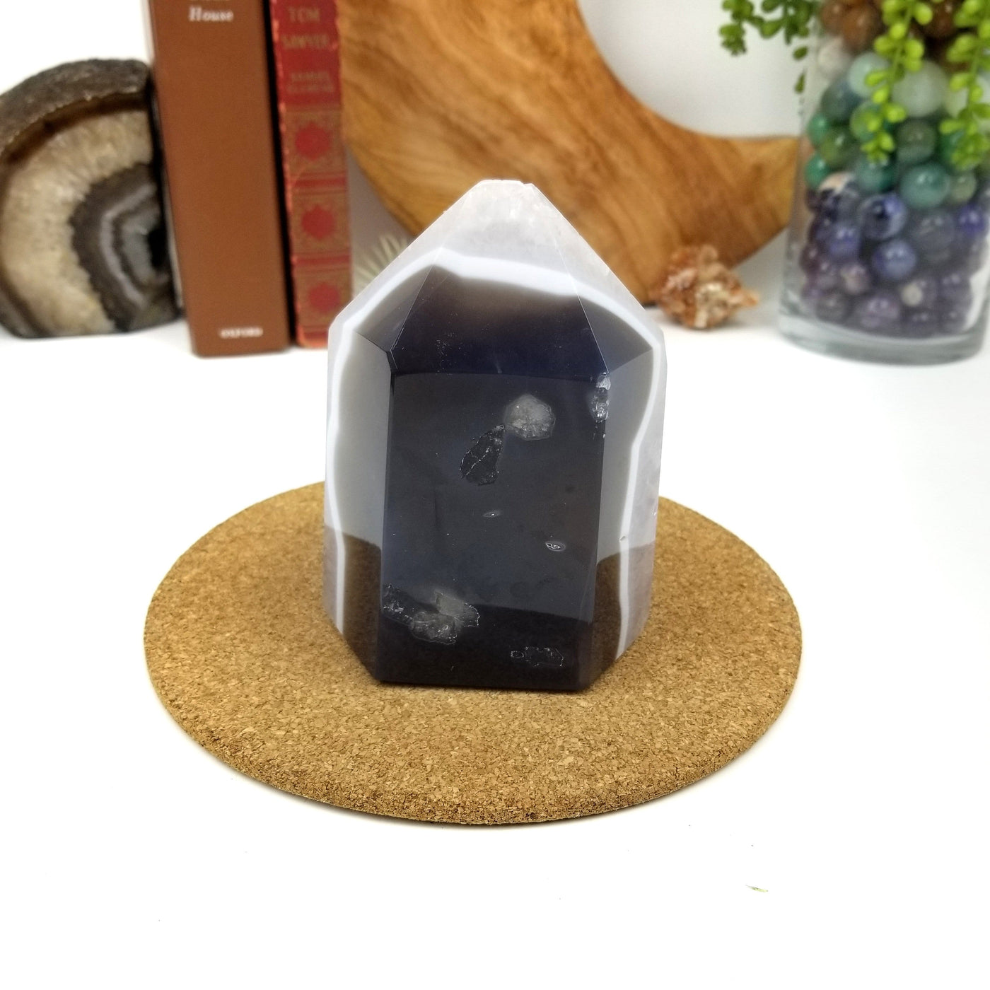 back view of Amethyst Geode Druzy Polished Cut Base with decorations in the background
