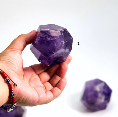 hand holding up Amethyst Dodecahedron