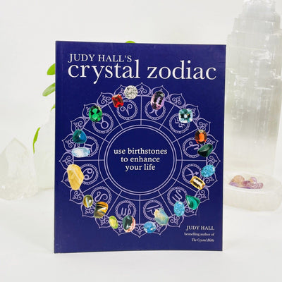 Crystal Guidance by Judy Hall with decorations in the background