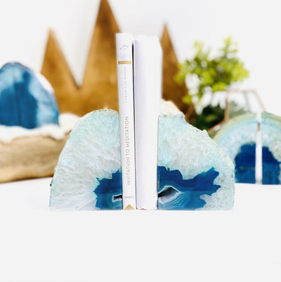 blue geode bookends with books in between