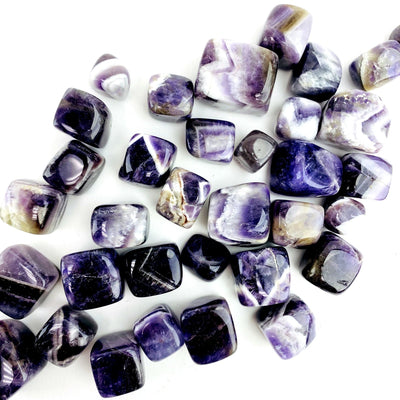 chevron amethyst tumbled cubes displayed to show the differences in the sizes 