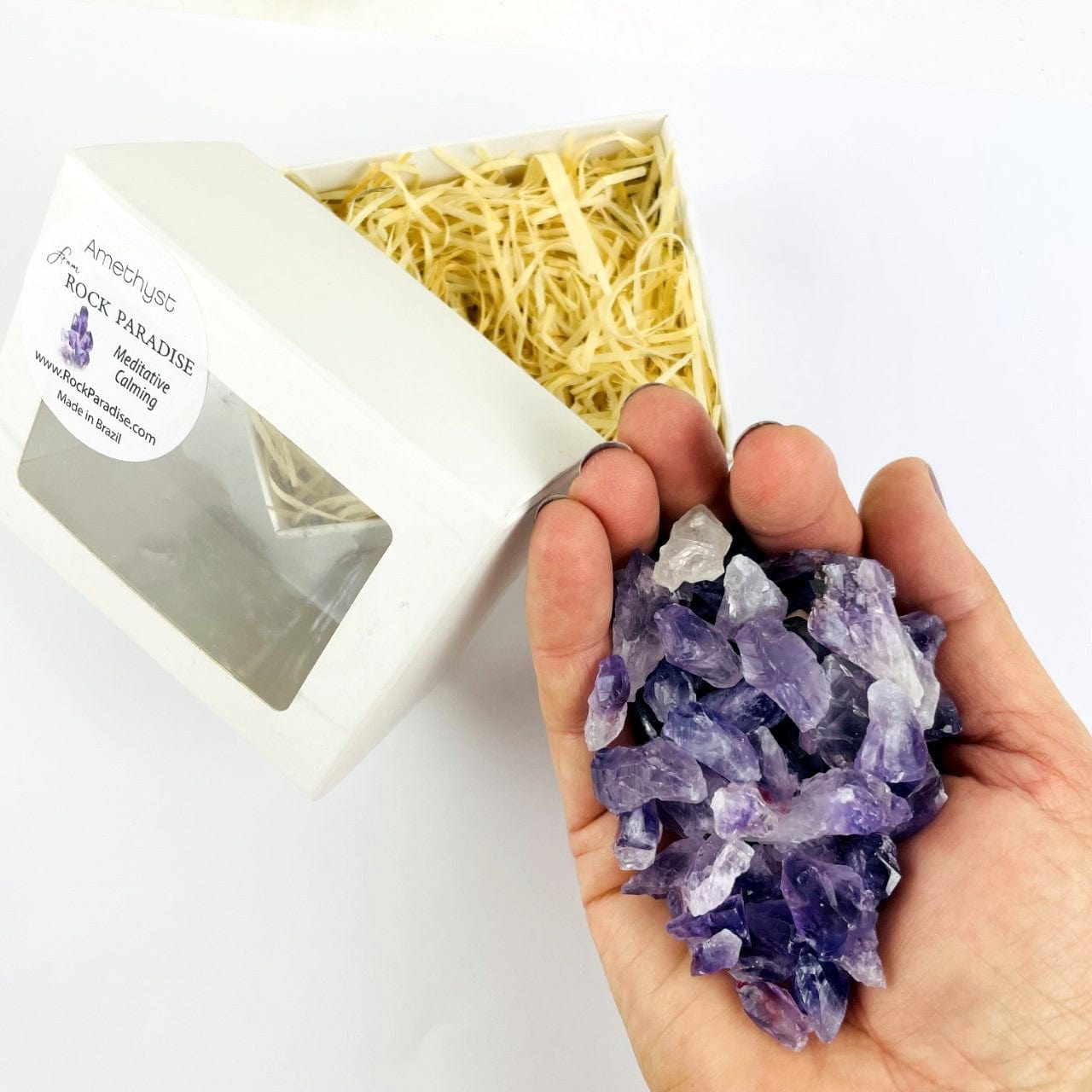 Amethyst Points - Chubbie Box of Stones with stones in a hand to show mount in box
