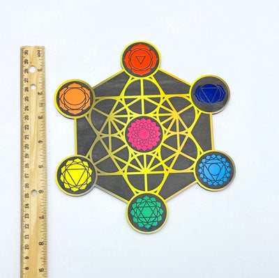 crystal grid next to a ruler for size reference 