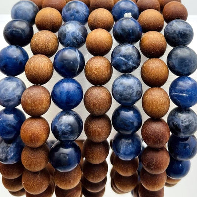 close up of sandalwood bead bracelets with sodalite on display for details and possible variations