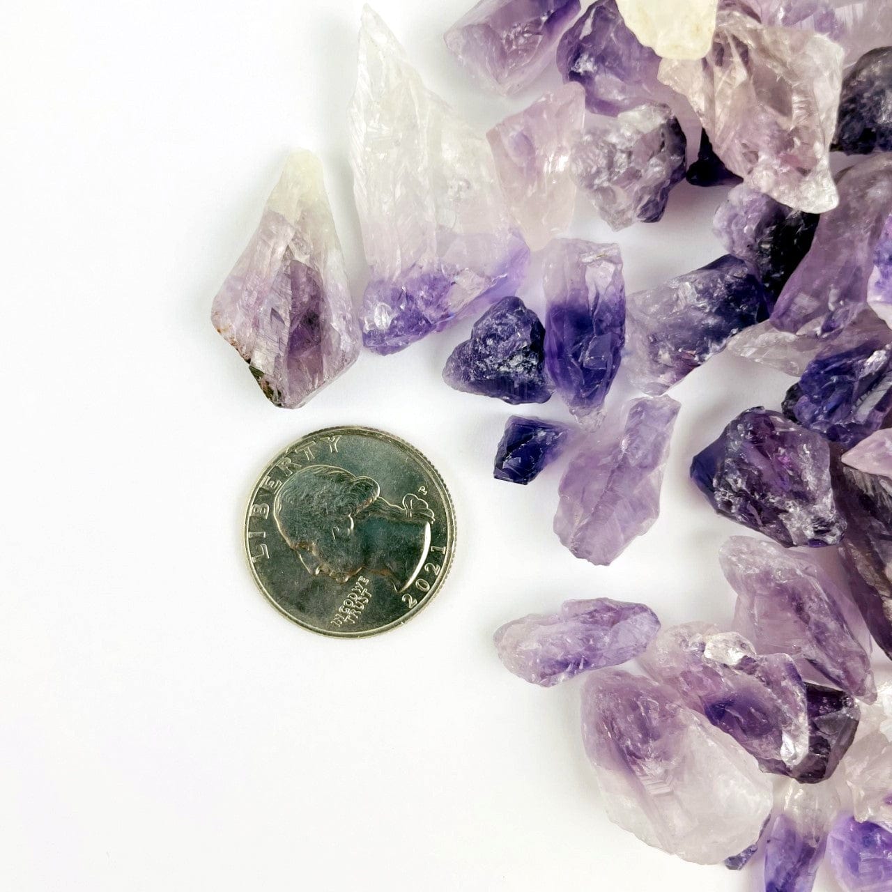 Amethyst Points - Chubbie Box of Stones shown next to a quarter for size