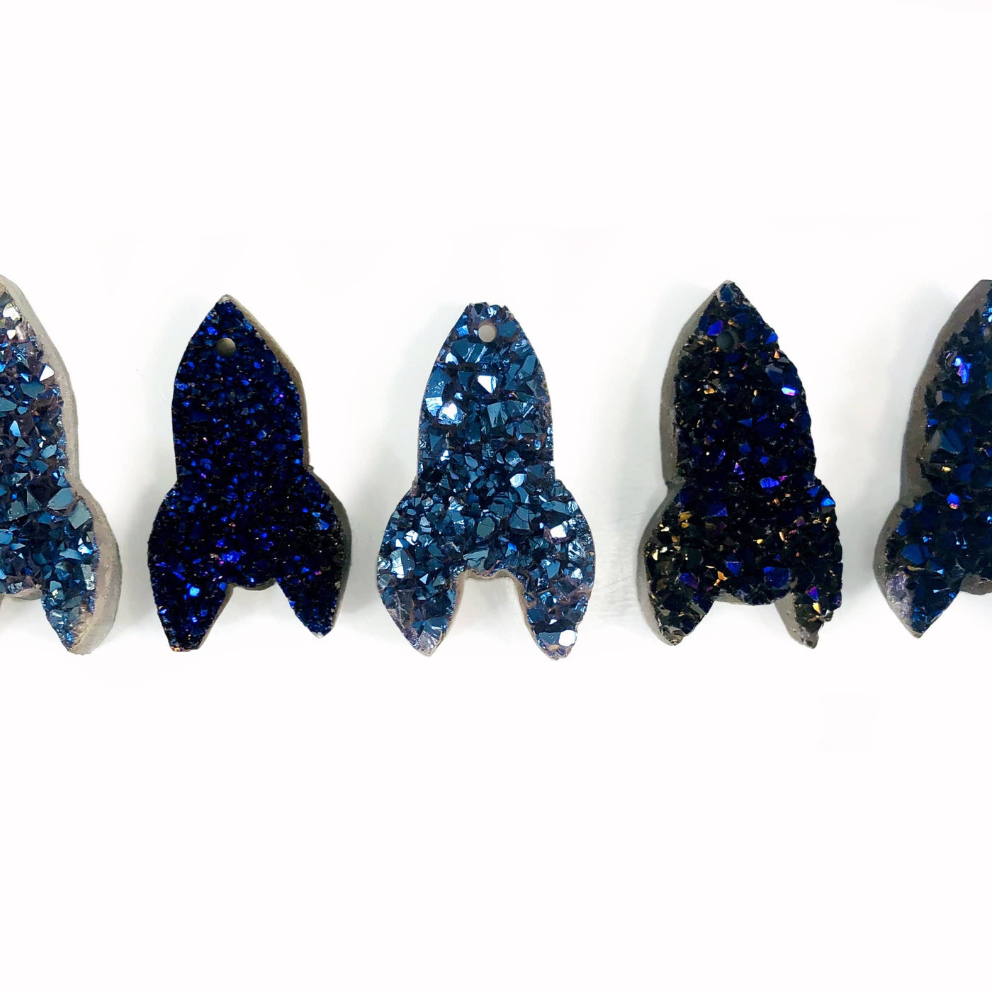 Druzy Rocket Shaped Cabochons  - blue in a row