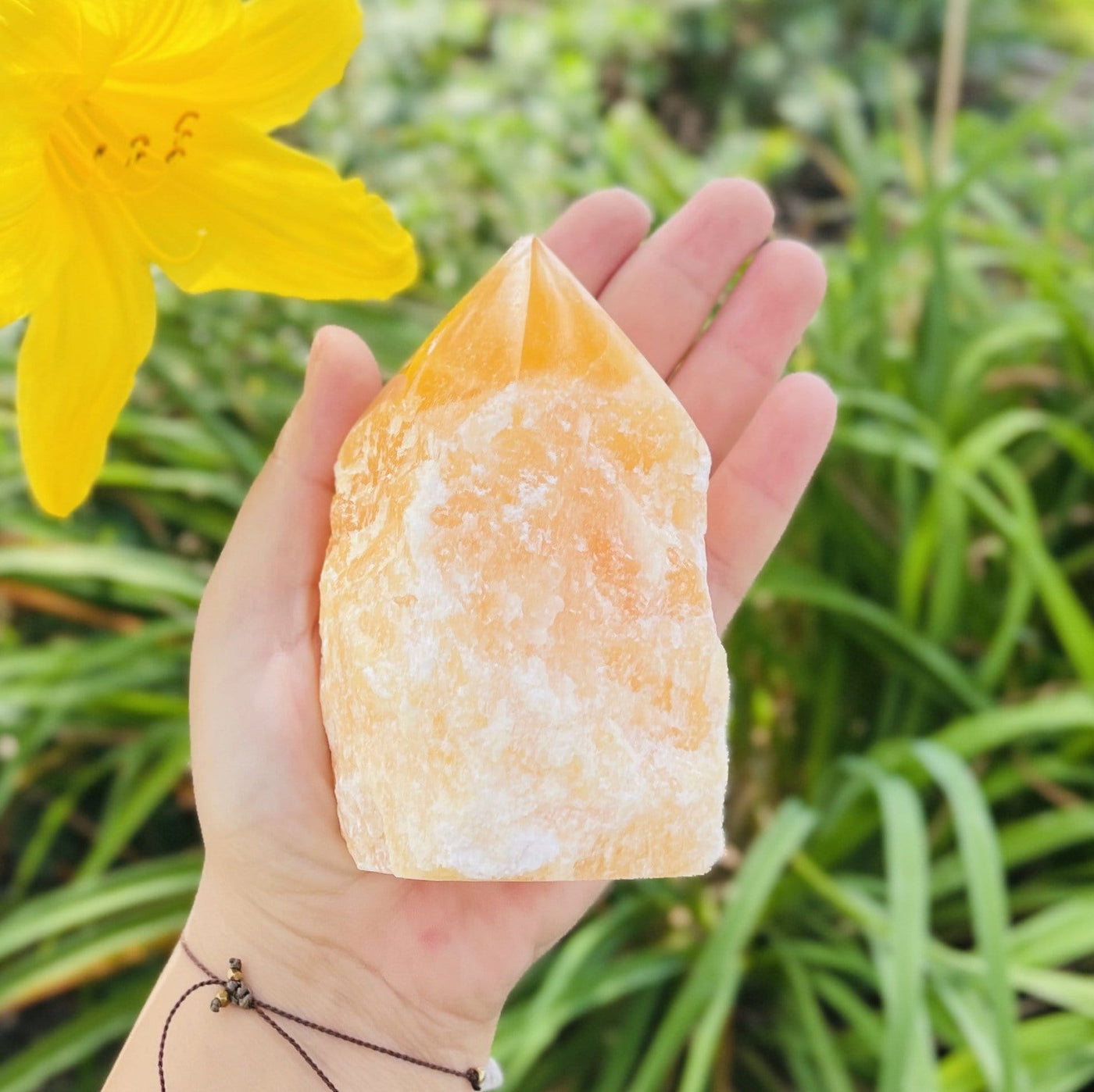 Orange Calcite Point - in a hand