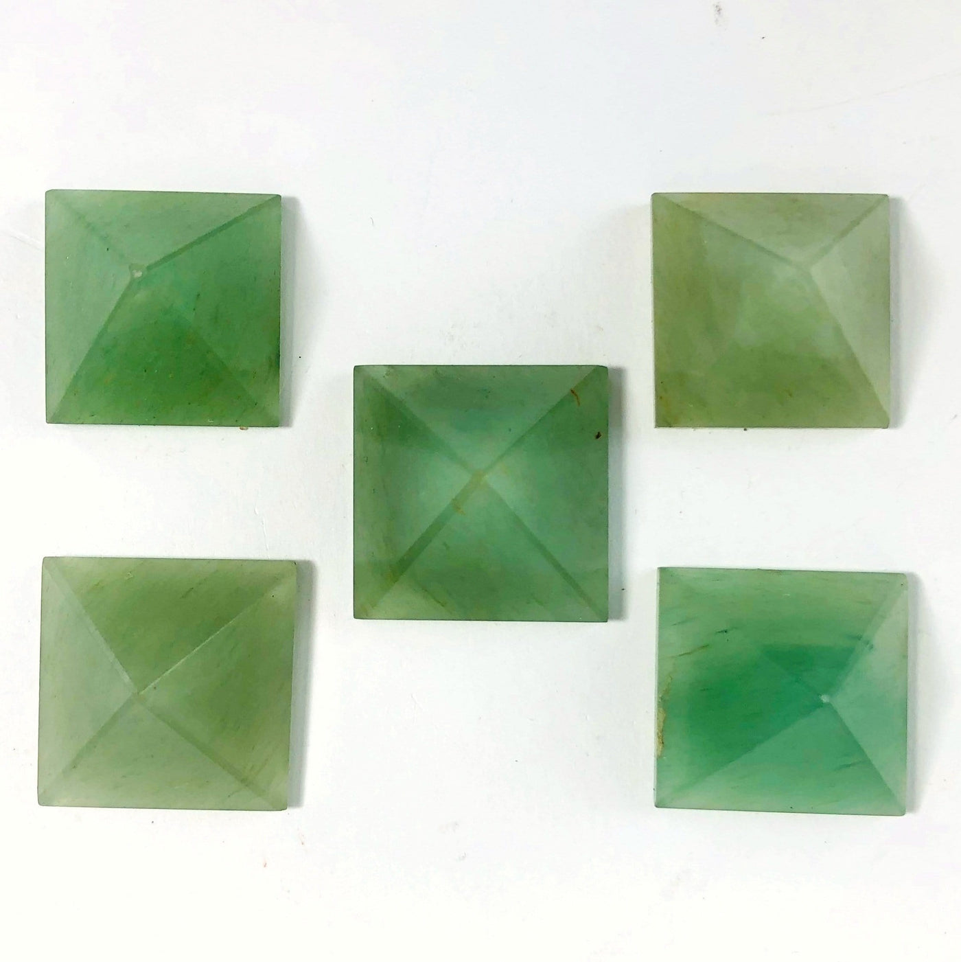 5 Green Aventurine Pyramids shot from above looking down