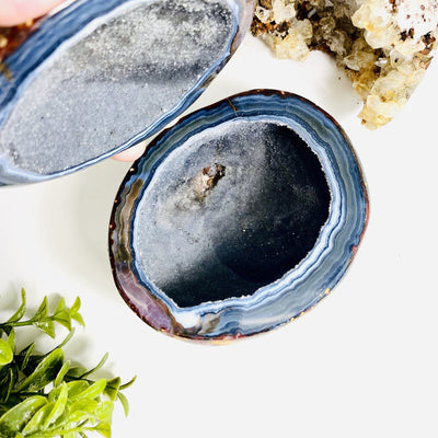 Agate Geode Box being held open by hand on a white background