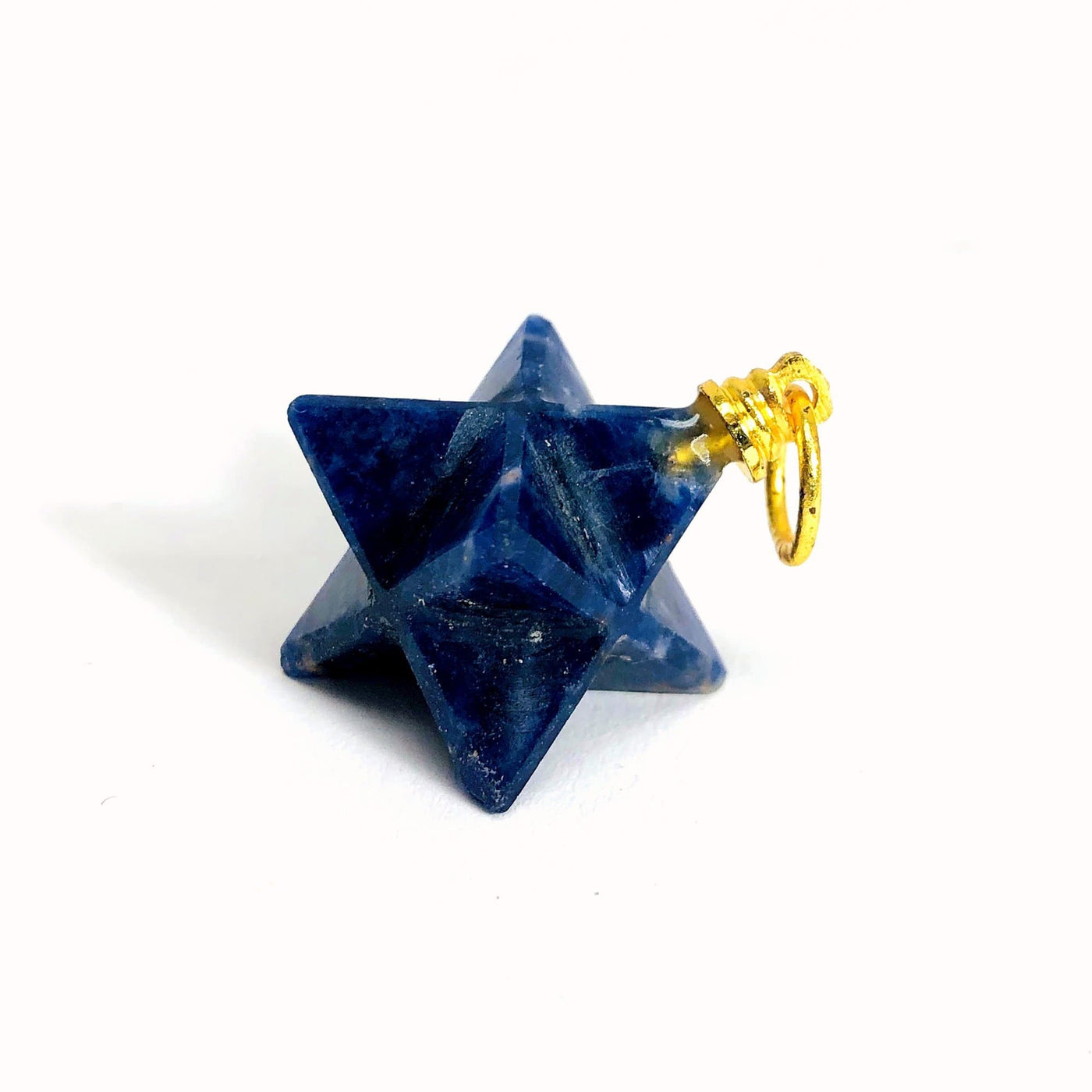 one sodalite merkaba star with gold bail on white background