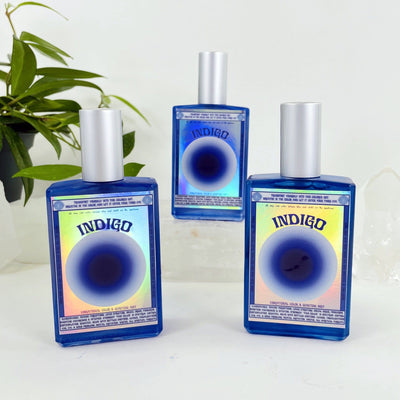 3 bottles of Gemstone Mist - Indigo Vibrational Color with decorations in the background