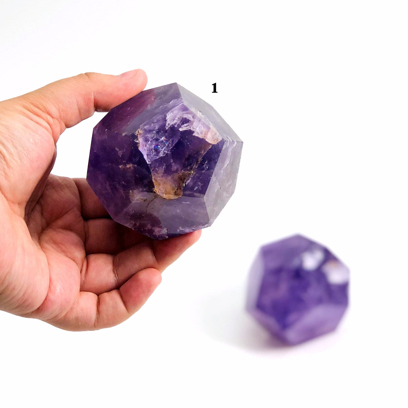 hand holding up variant 1 of Amethyst Dodecahedron
