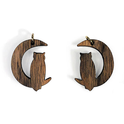2 wooden cat pendants on white background