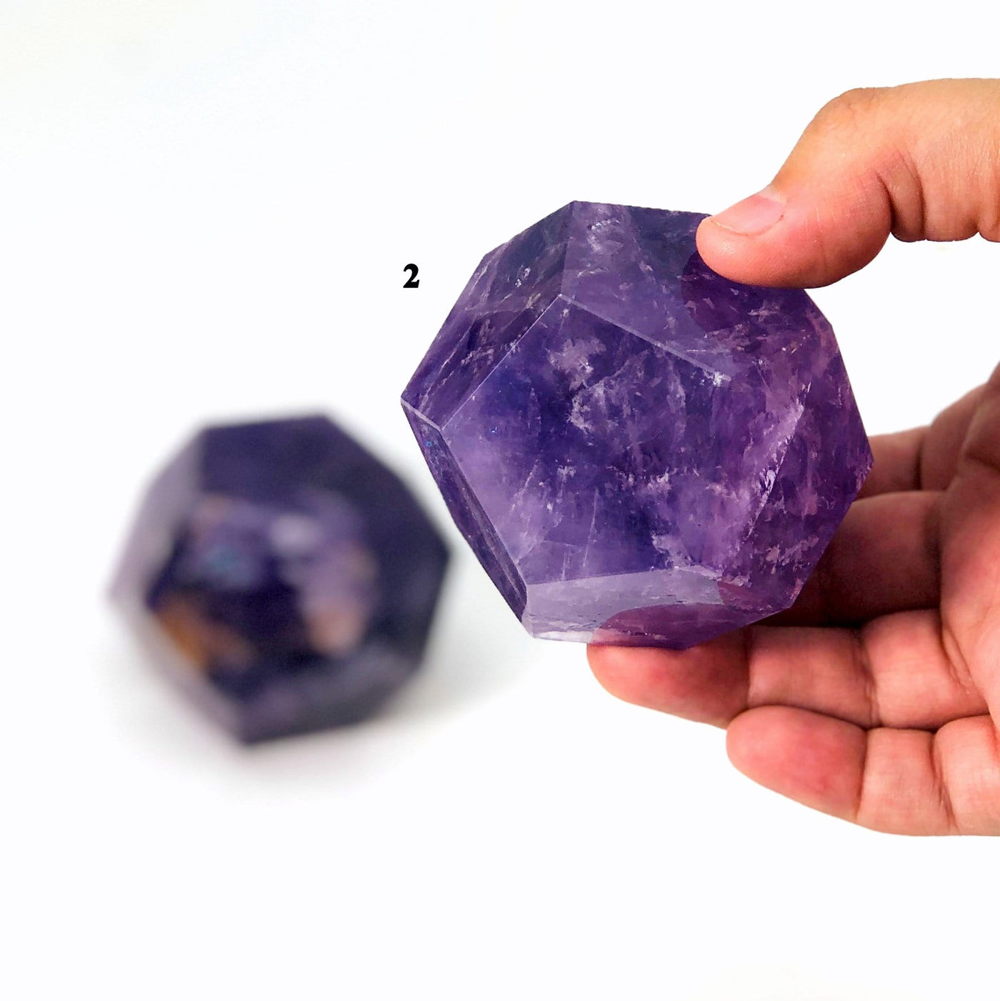 hand holding up variant 2 of Amethyst Dodecahedron