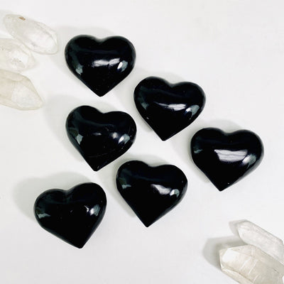 black onyx hearts on a table