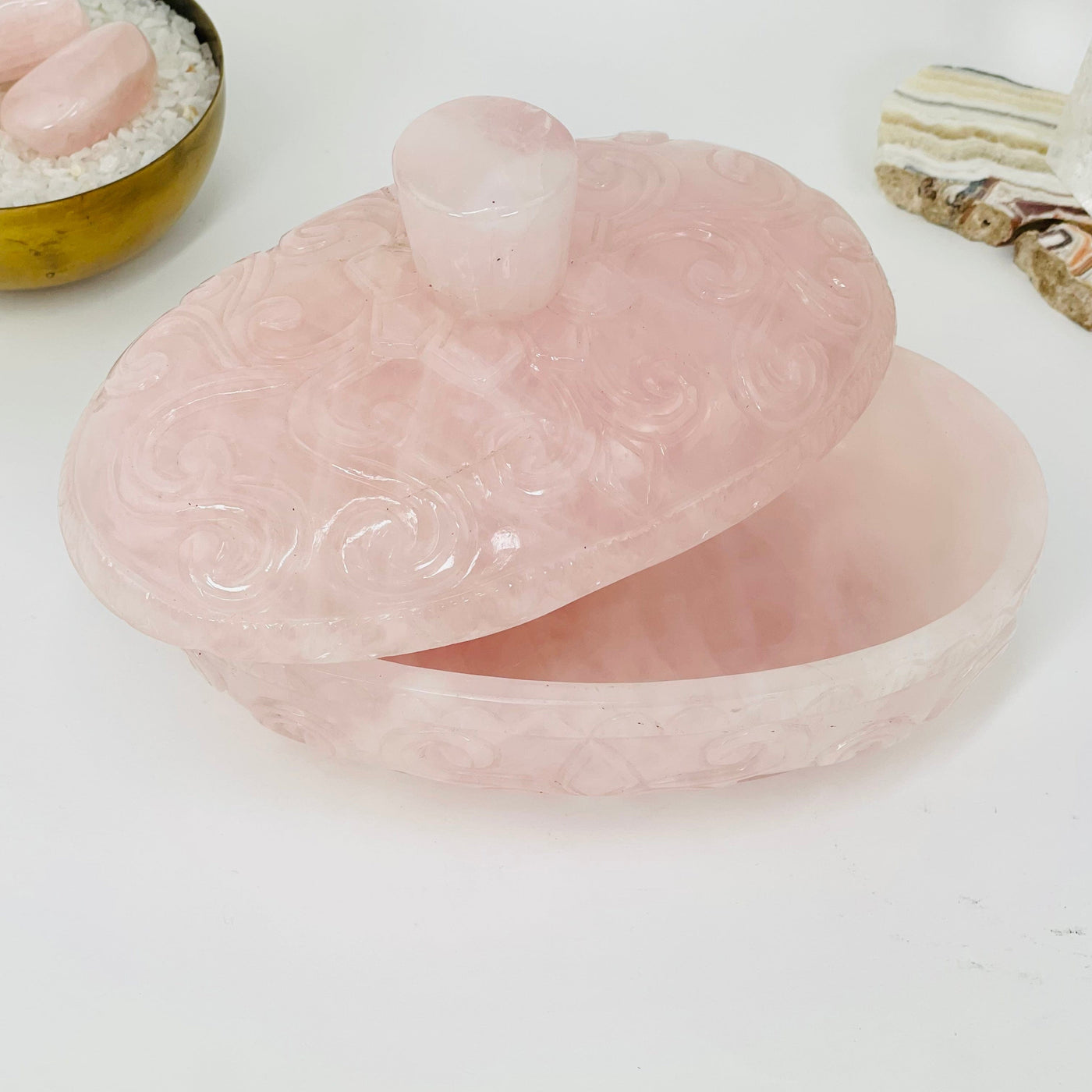 rose quartz bowl displayed with lid half off to show how deep it is 